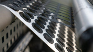 IMPACT CSS Fitchett die-cutting-in-line-slug-removal-on-a-rotary-press