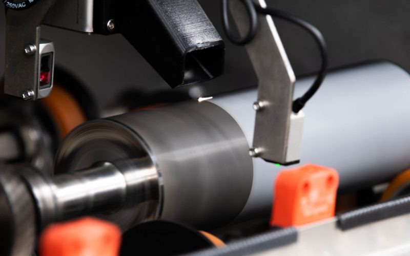 Close up of laser ablating ink off an anilox roll in the laser anilox cleaner.Photos courtesy of Flexo Wash